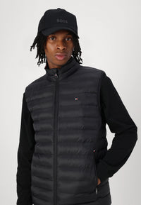 Doudoune sans manches homme Tommy Hilfiger noire – Gilet matelassé léger, confort, hiver mi-saison.